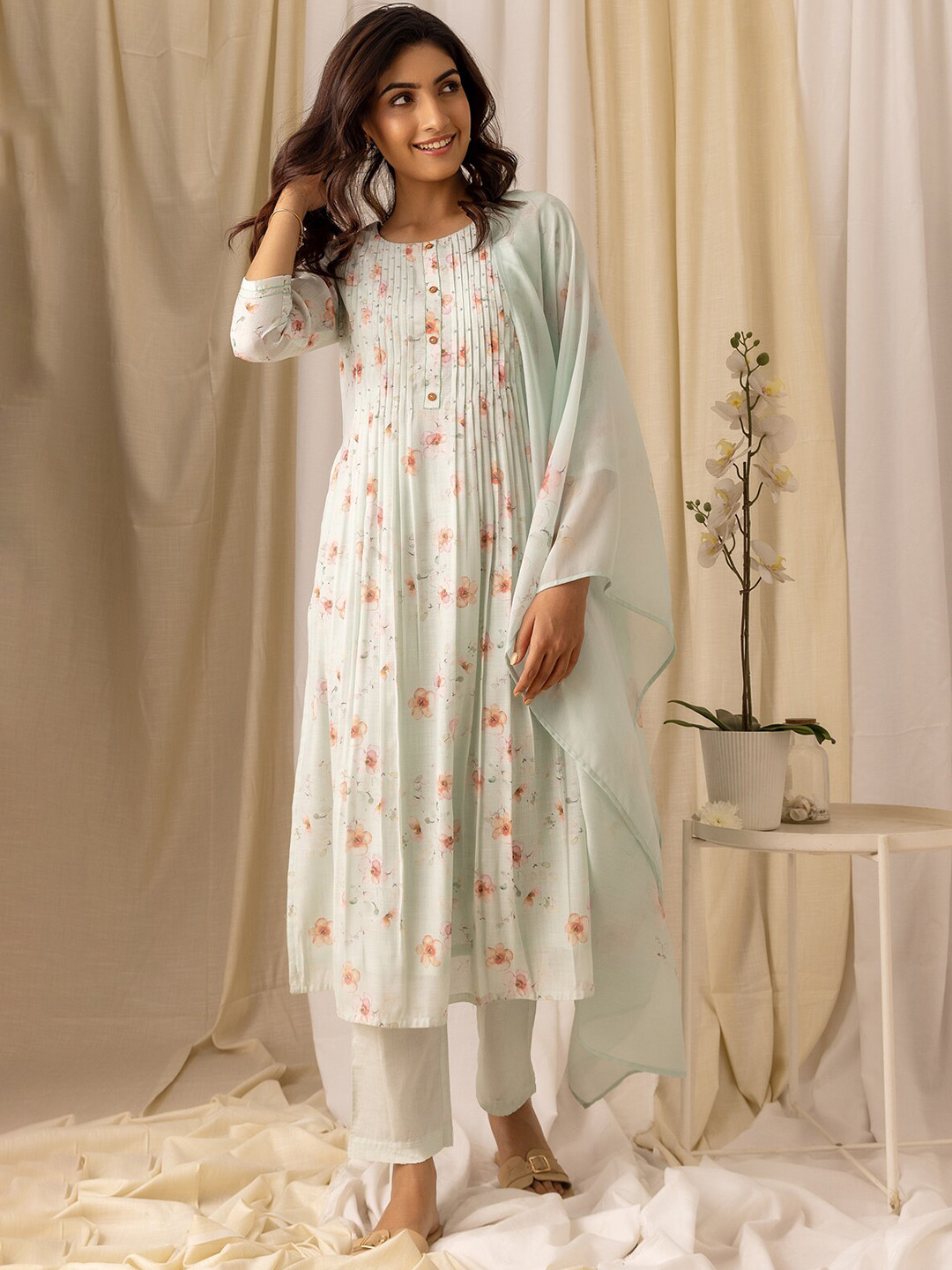 

Ishin Floral Printed Beads and Stones Pleated Linen A-Line Kurta with Trousers & Dupatta, Turquoise blue
