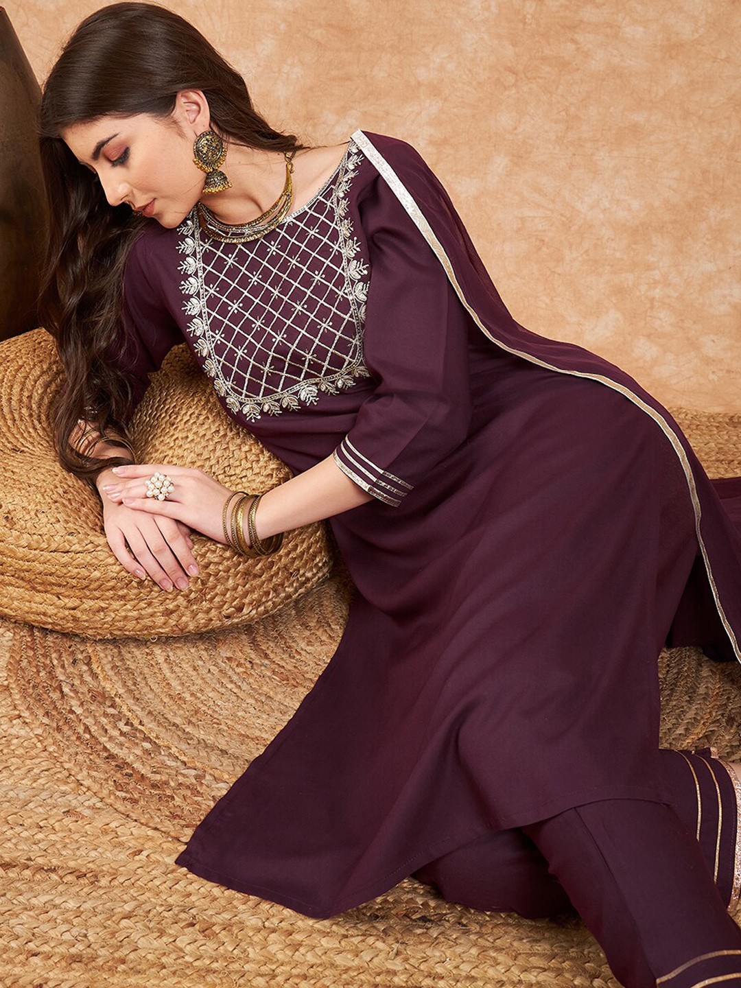 

Sangria Purple Ethnic Motifs Yoke Design Thread Work Kurta With Trousers And Dupatta