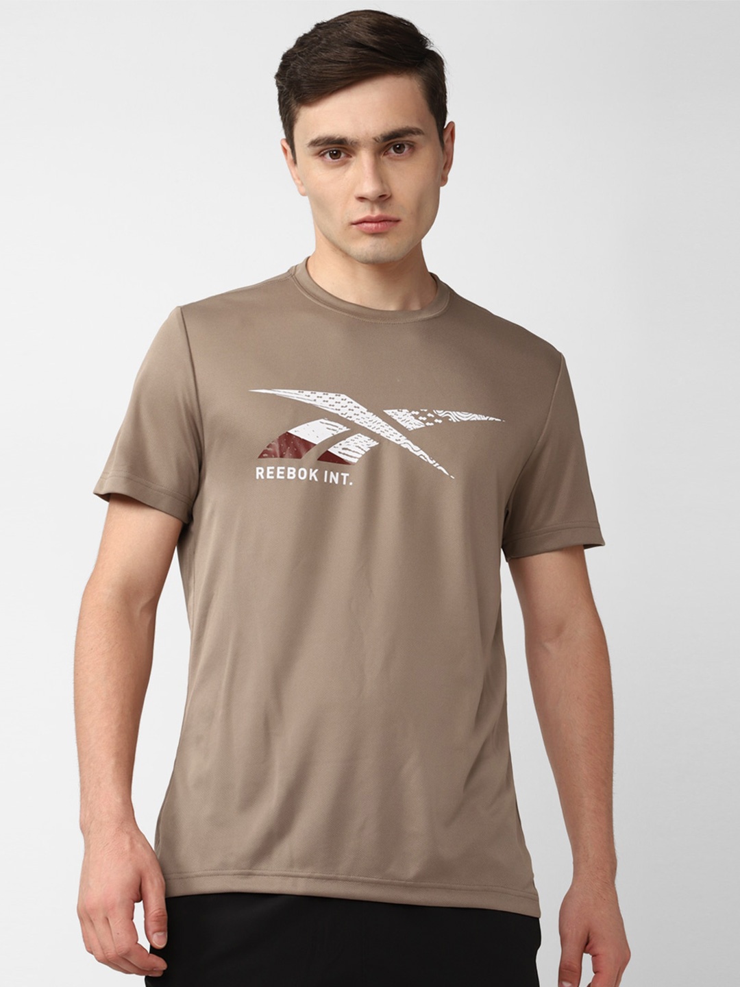 

Reebok Gr Brand Logo Printed Round Neck T-Shirt, Brown