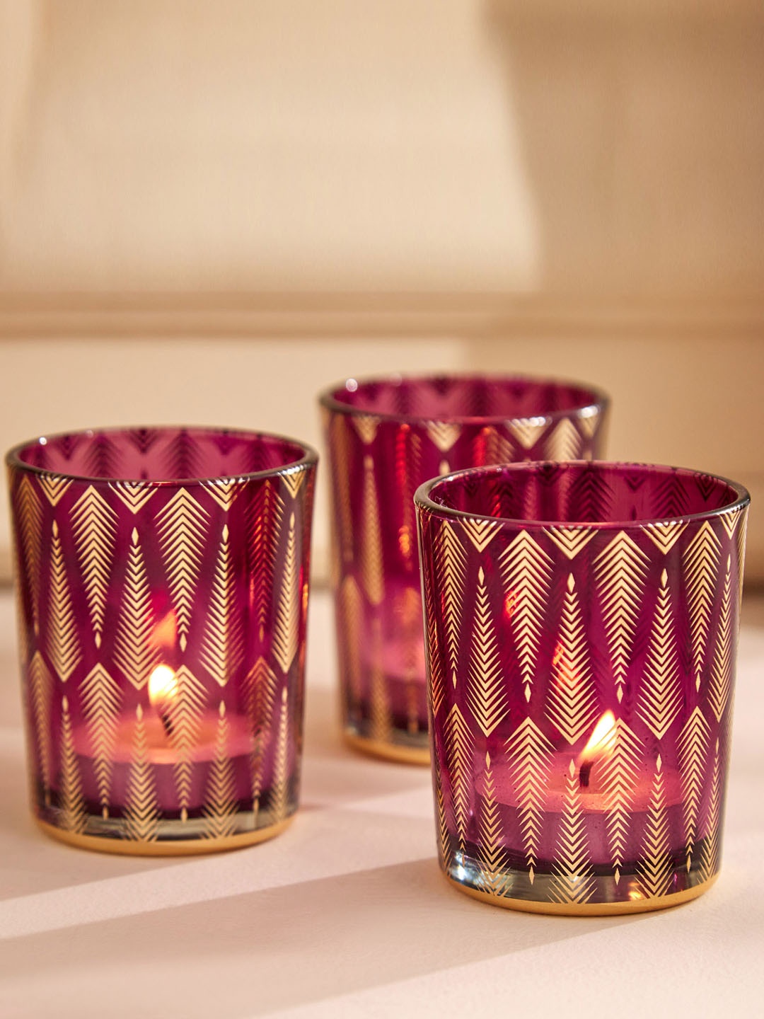 

Home Centre Purple 3-Pieces Glass T-Light Candle Holders
