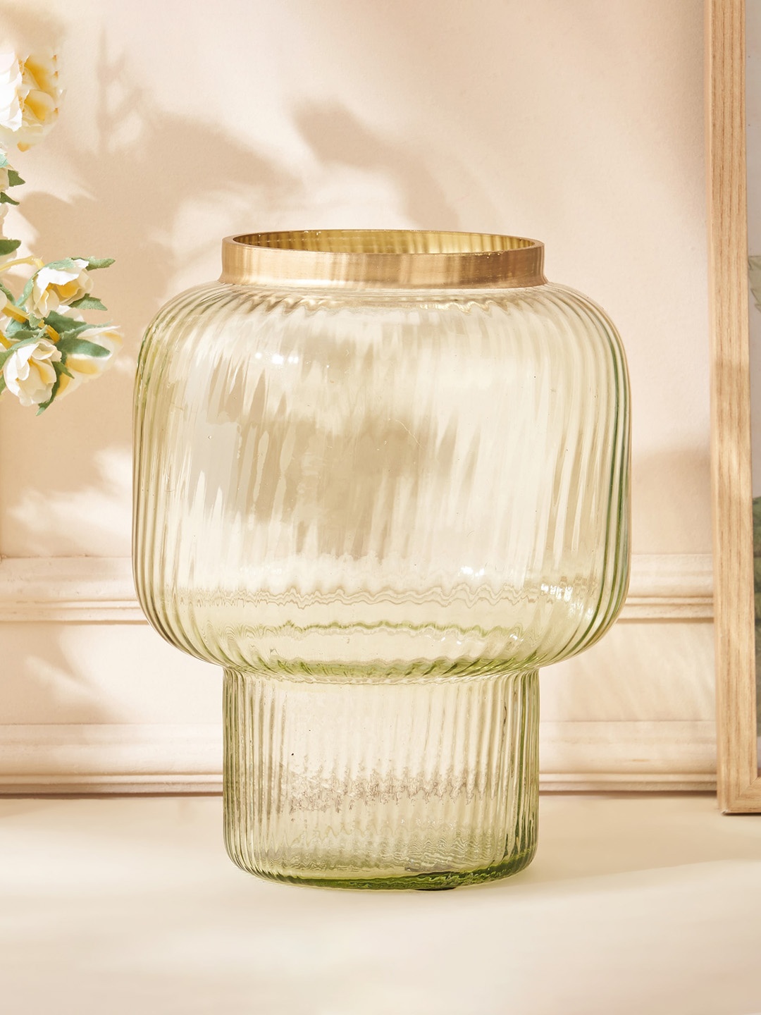 

Home Centre Moksha Neysa Transparent Glass Ribbed Broad Mouth Vase