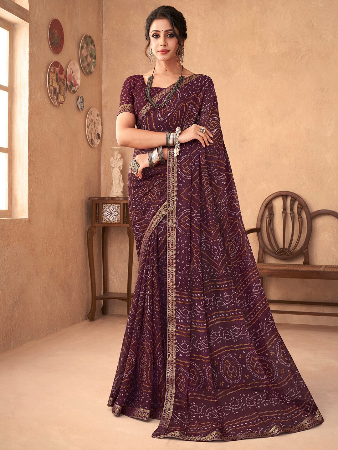 

Anouk Rustic Purple Printed Zari Pure Chiffon Bandhani Saree