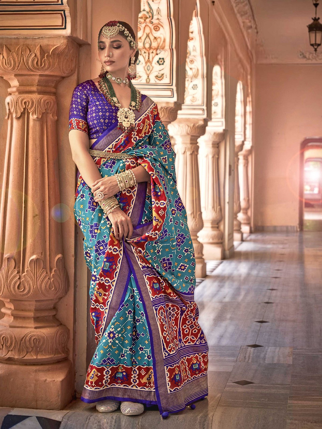 

Mitera Blue Ethnic Motifs Printed Zari Detail Patola Saree