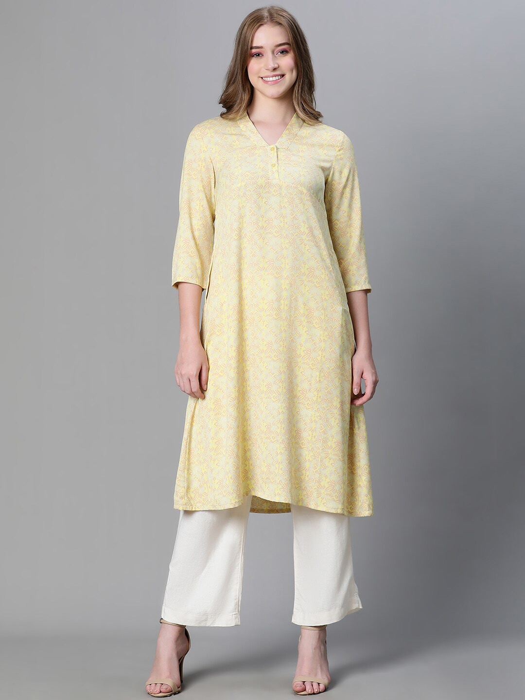 

Oxolloxo Floral Printed V-Neck A-Line Kurta, Yellow