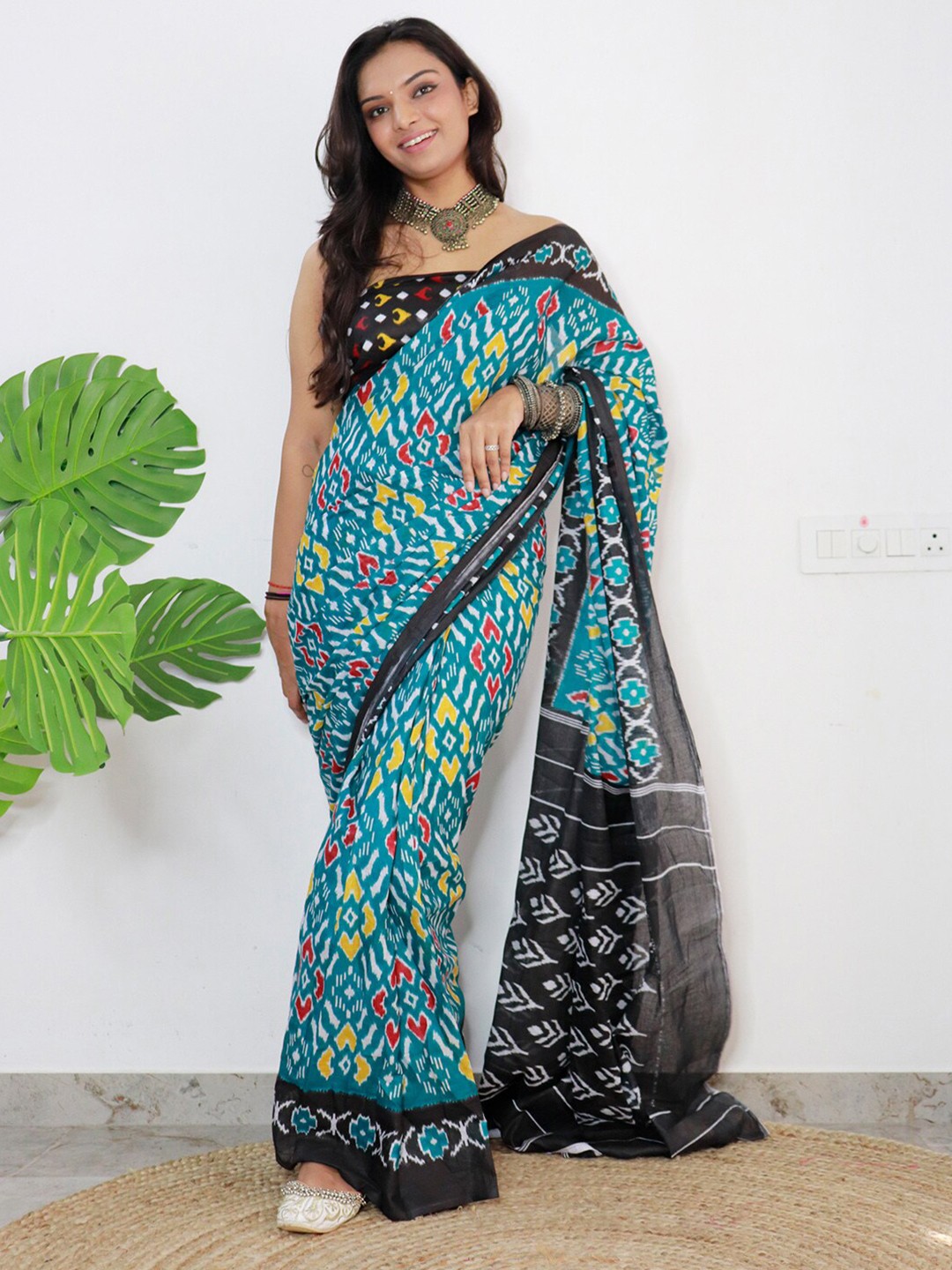 

Saree mall Blue & Black Ethnic Motifs Printed Pure Cotton Ikat Sarees