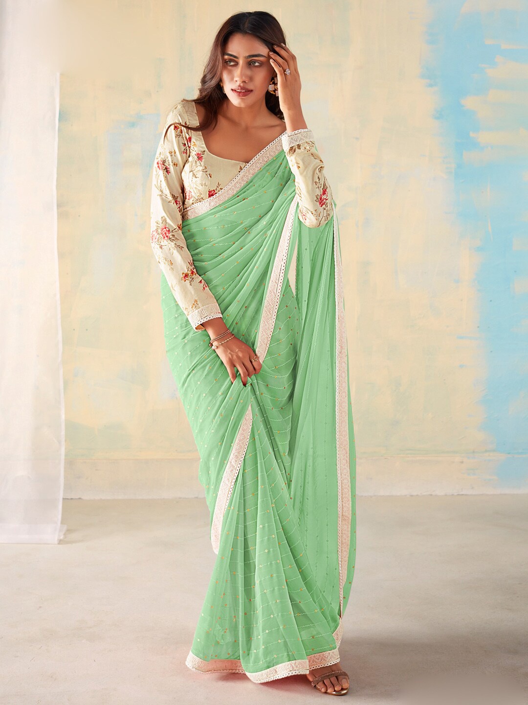 

Saree mall Green & White Embellished Sequinned Pure Georgette Sarees