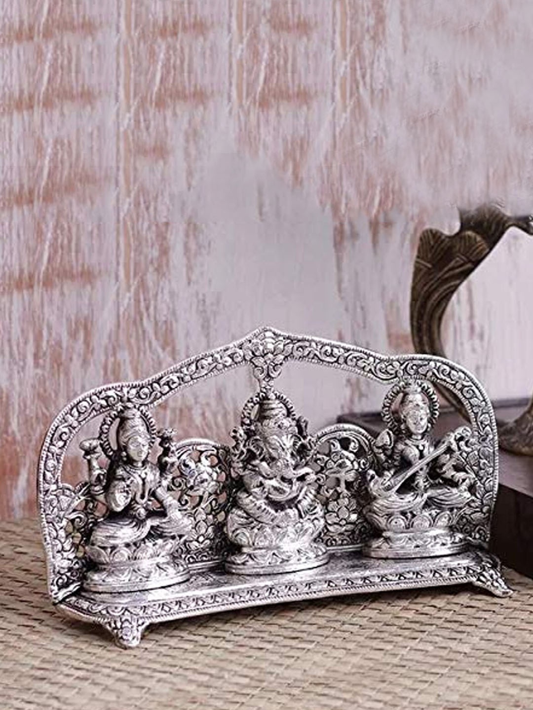 

Two Moustaches Silver-Toned Aluminium Laxmi Ganesh Saraswati Idol Showpiece