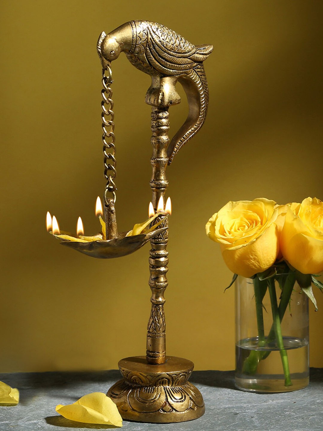 

Two Moustaches Gold-Toned Parrot Design Brass Diya