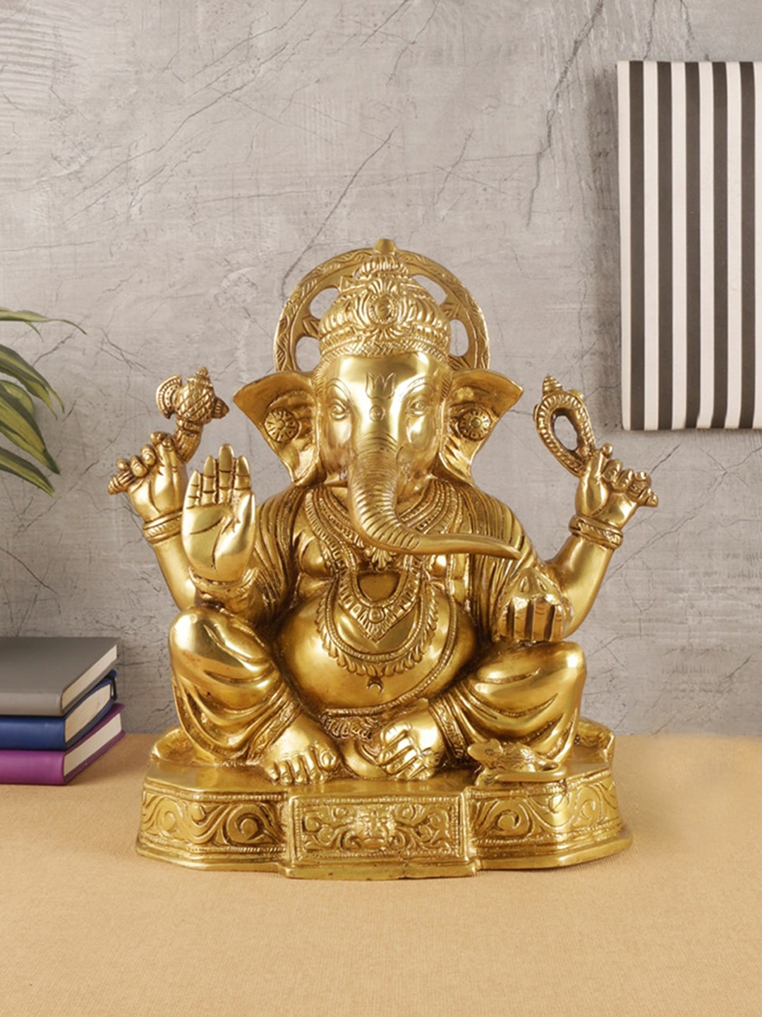 

Two Moustaches Gold Toned Handcarved Brass Lord Ganesha Statue Showpiece