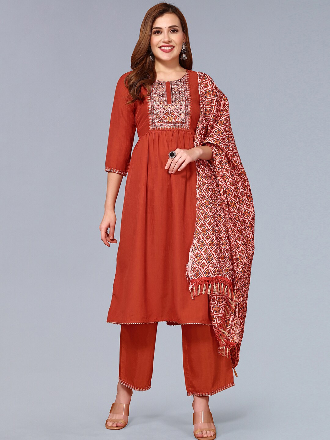 

SKYLEE Yoke Design Regular Thread Work Kurta With Trousers & Dupatta, Orange