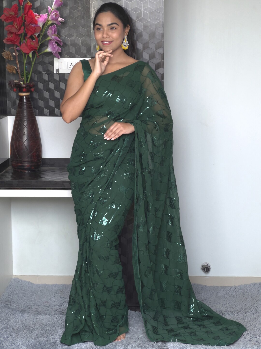 

Mitera Green Embellished Sequinned Pure Georgette Saree