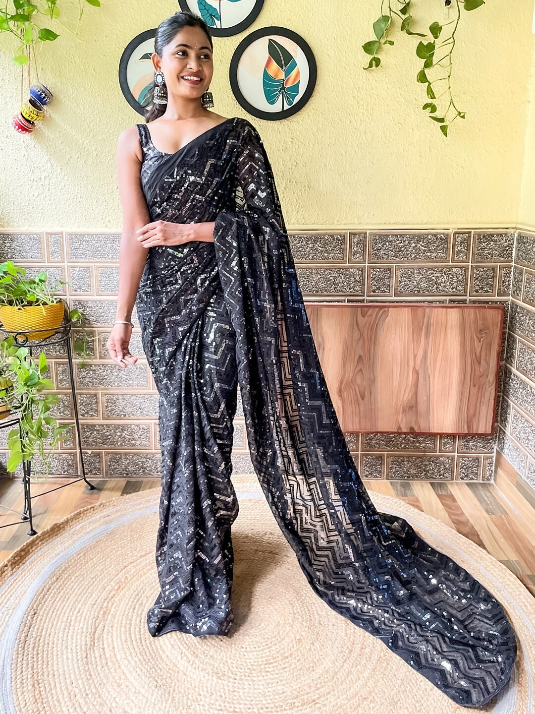 

Mitera Black Embellished Sequinned Poly Georgette Saree