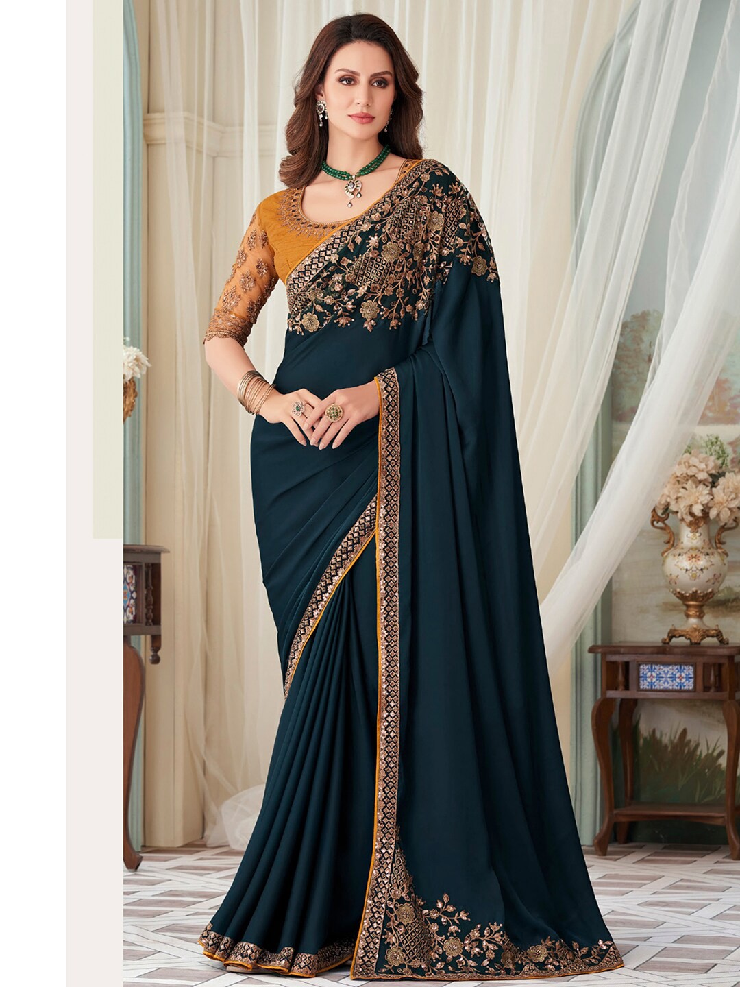 

Mitera Teal Floral Embroidered Sequinned Satin Saree