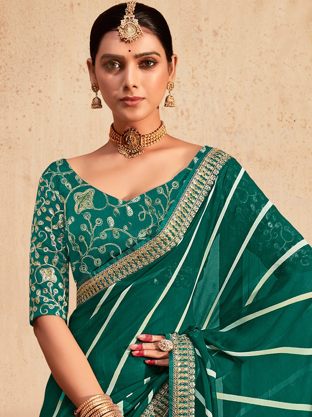 

Mitera Teal White Striped Embroidered Poly Georgette Saree
