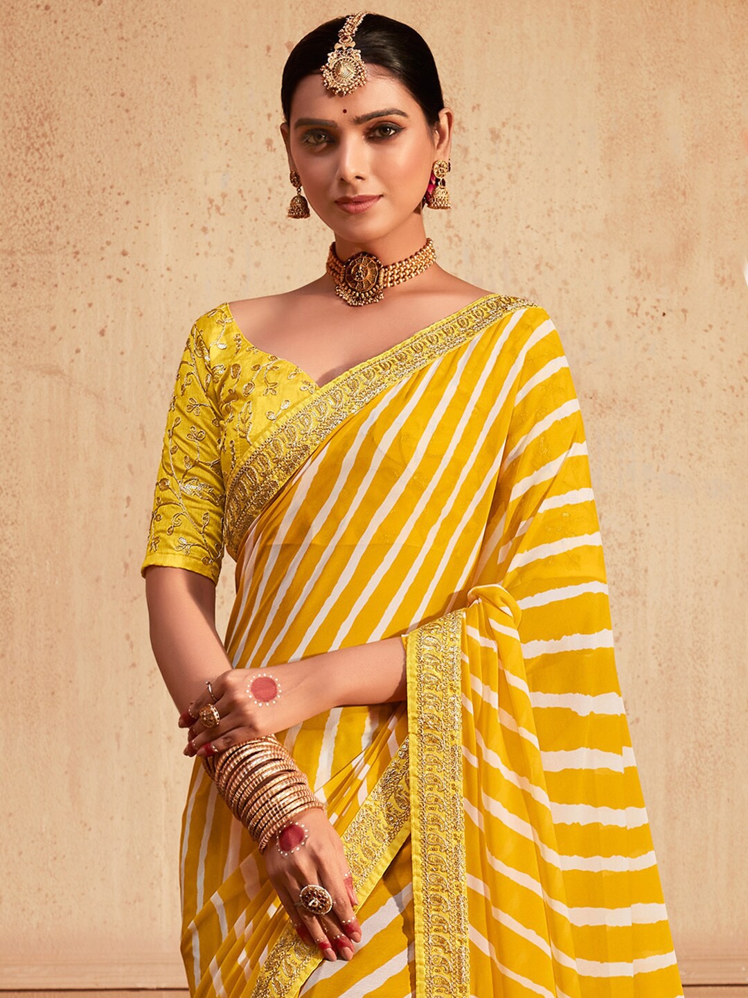

Mitera Yellow & White Leheriya Printed Embroidered Pure Georgette Leheriya Saree
