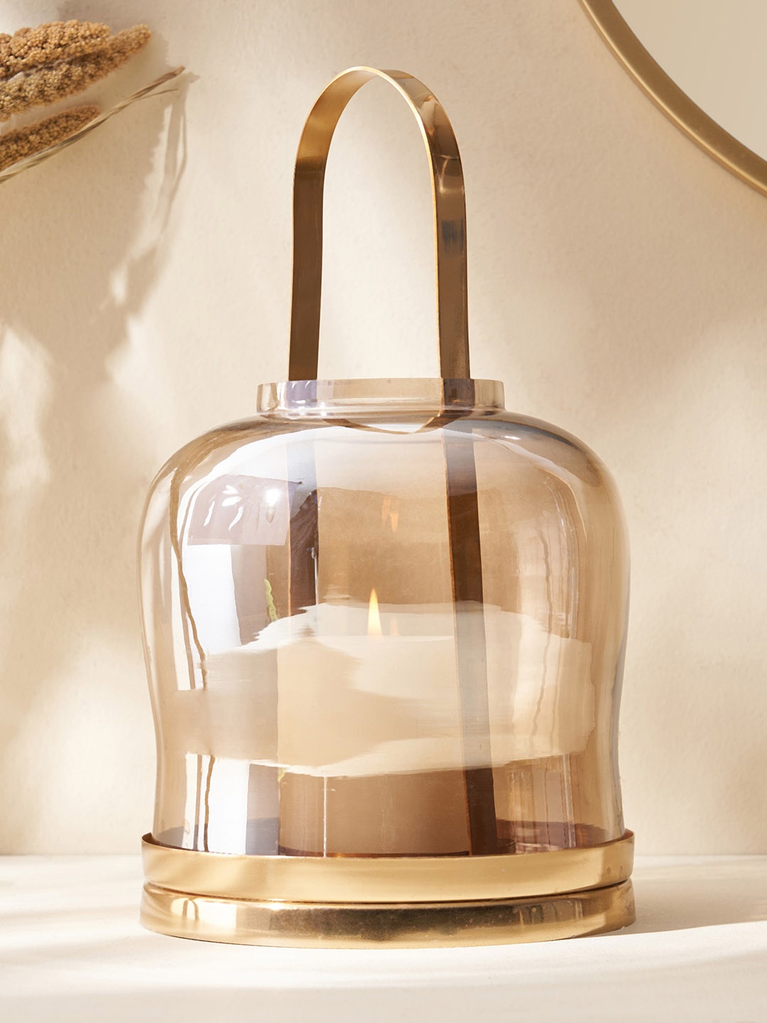 

Home Centre Metal & Clear Glass Candle Holder, Gold