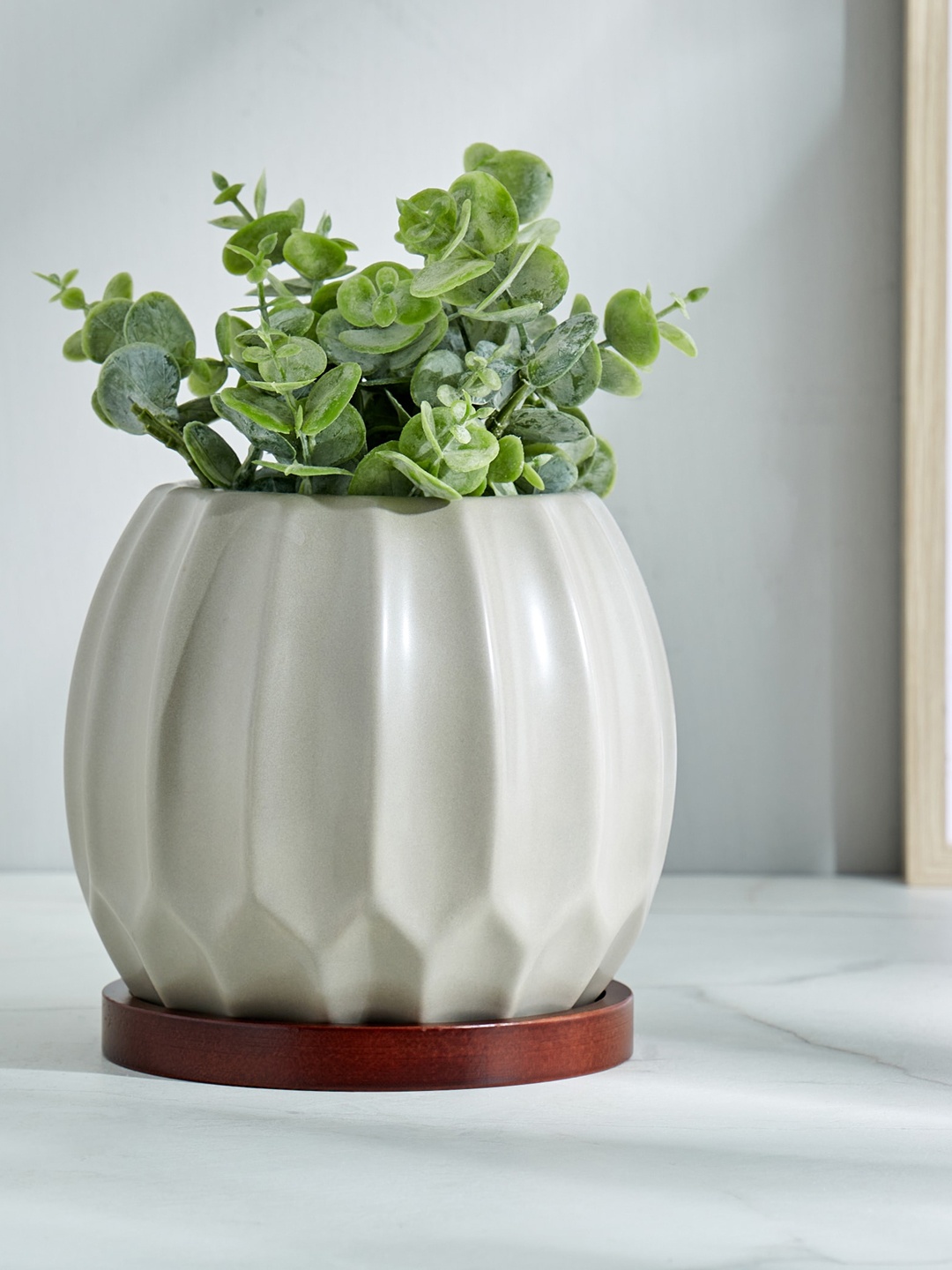 

Home Centre Gloria Argil Off White Textured Ceramic Planter With Wooden Stand