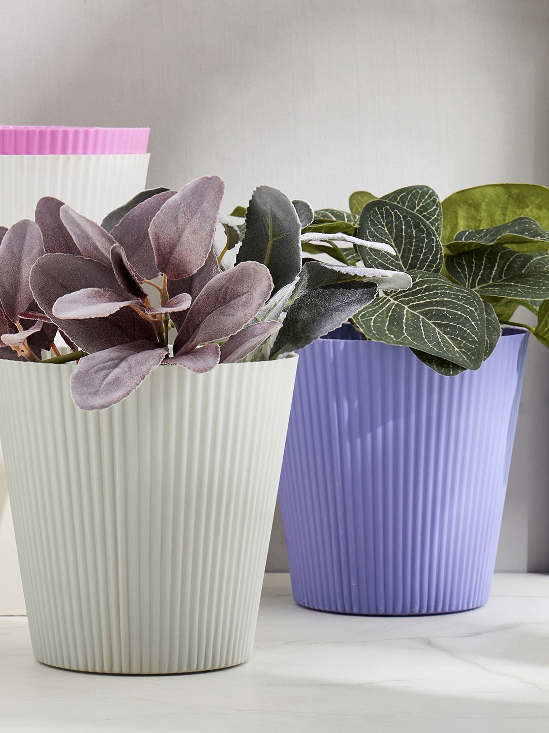 

Home Centre Lets Garden Radicle Home Centre White Ribbed Textured Planter