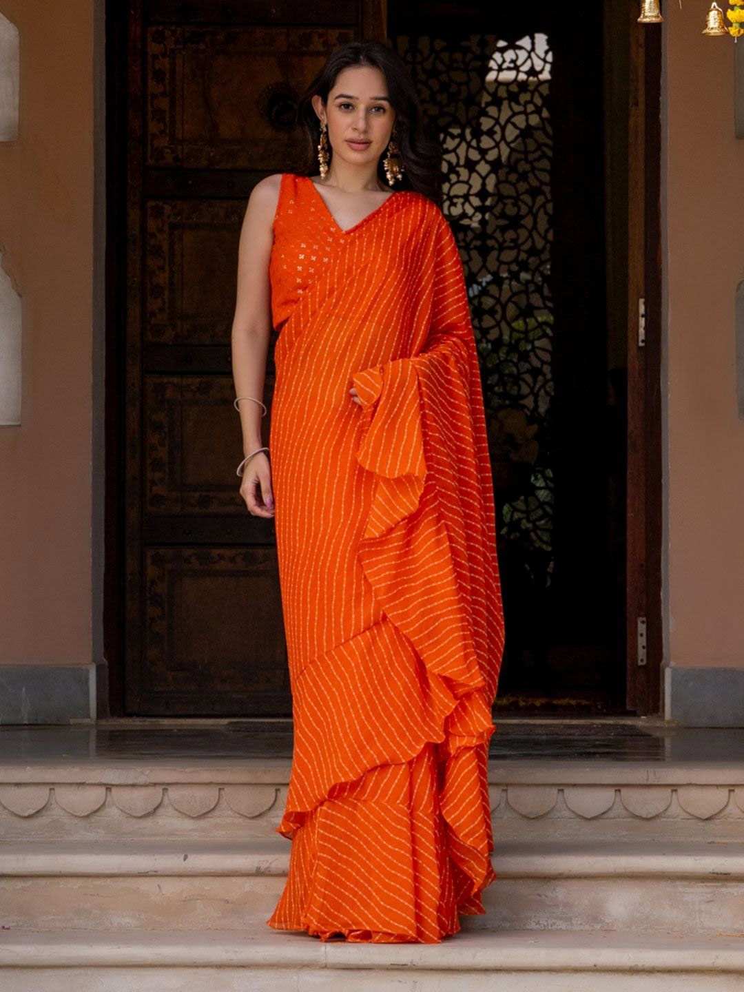 

HOUSE OF JAMOTI Striped Pure Georgette Saree, Orange
