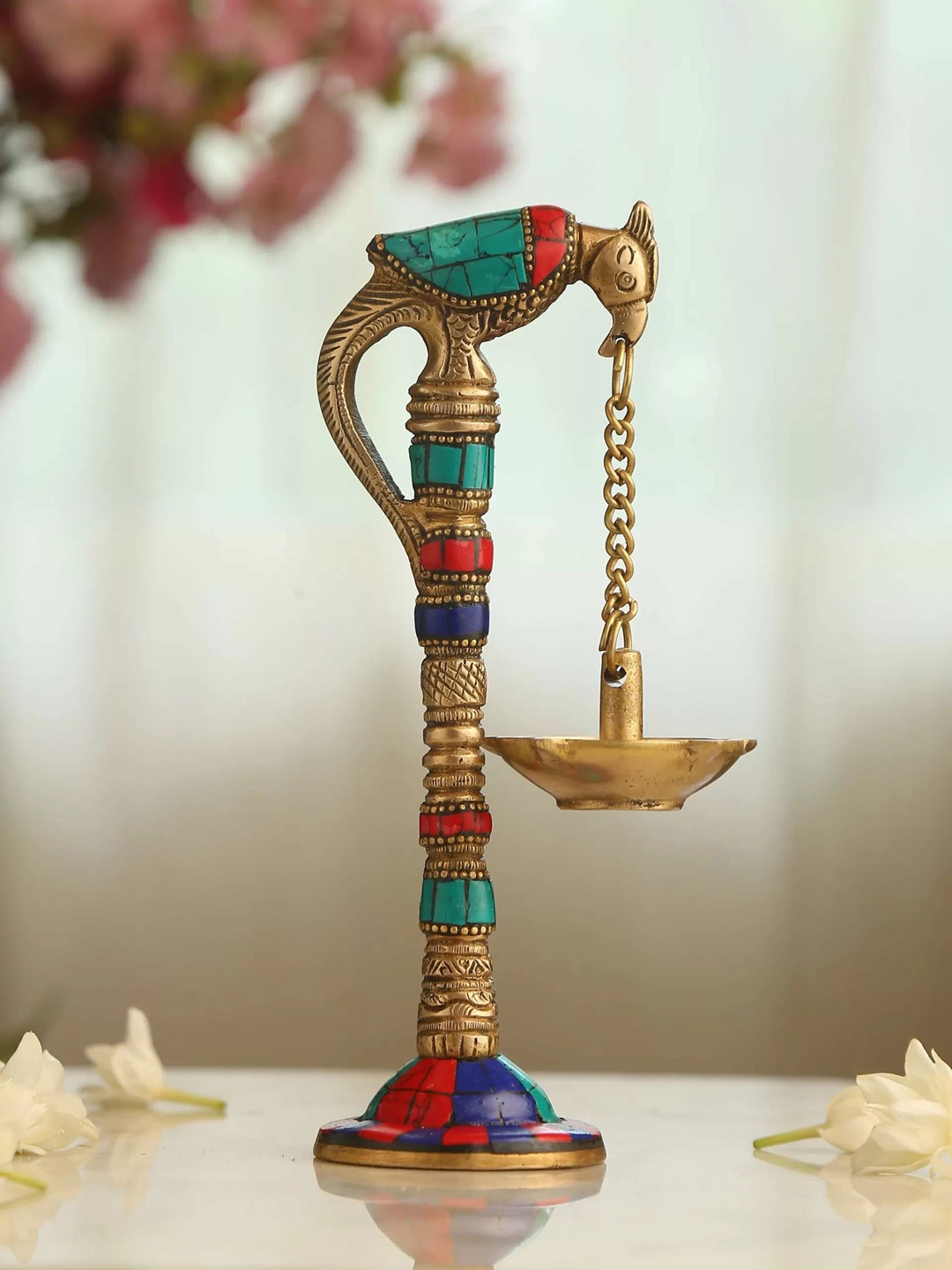 

Amoliconcepts Divine Splendour Gold Toned & Blue Stone-studded Parrot Hanging Diya