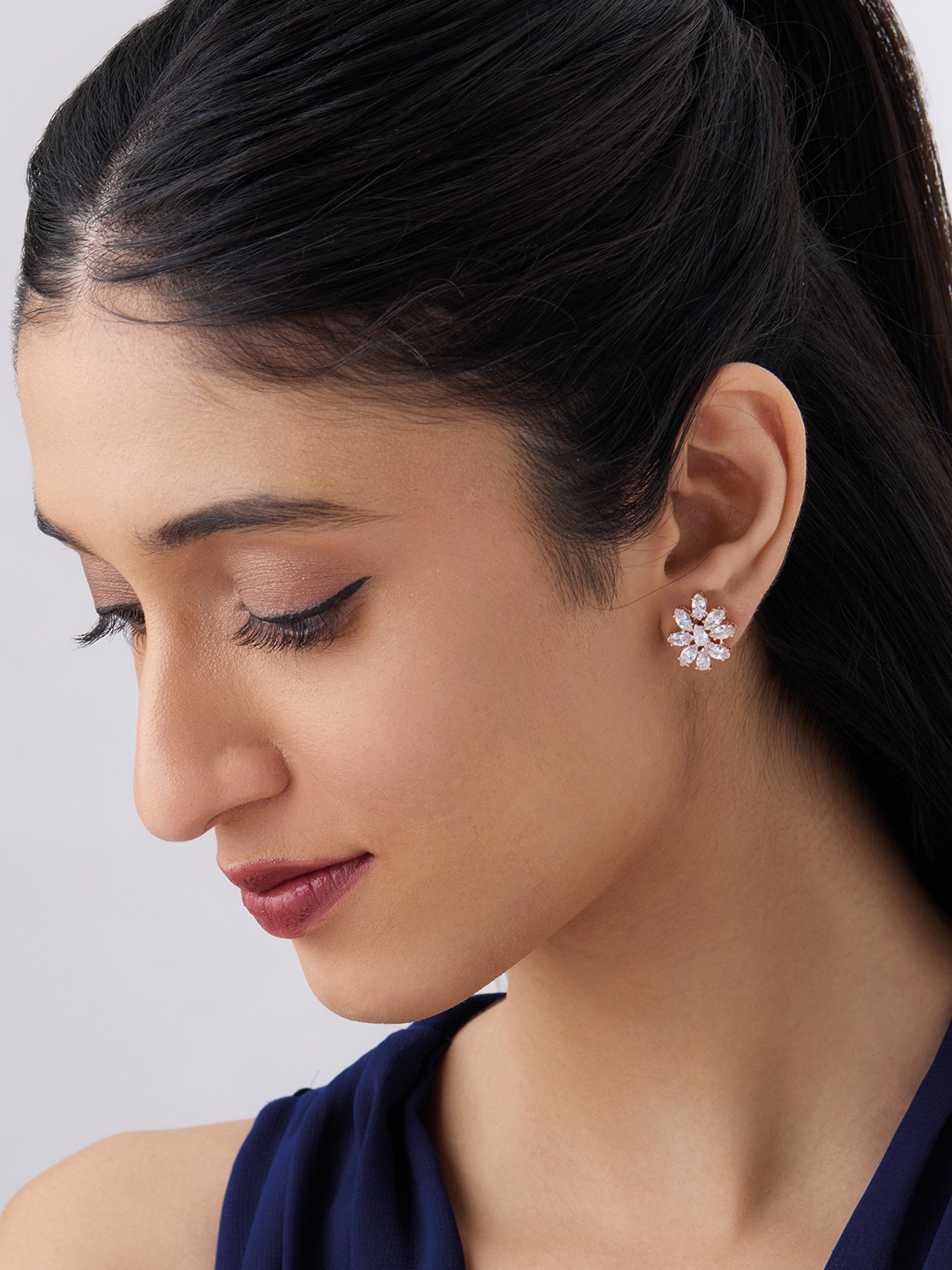 

Kushal's Fashion Jewellery Rose Gold Plated Cubic Zirconia Stone Studded Studs Earrings