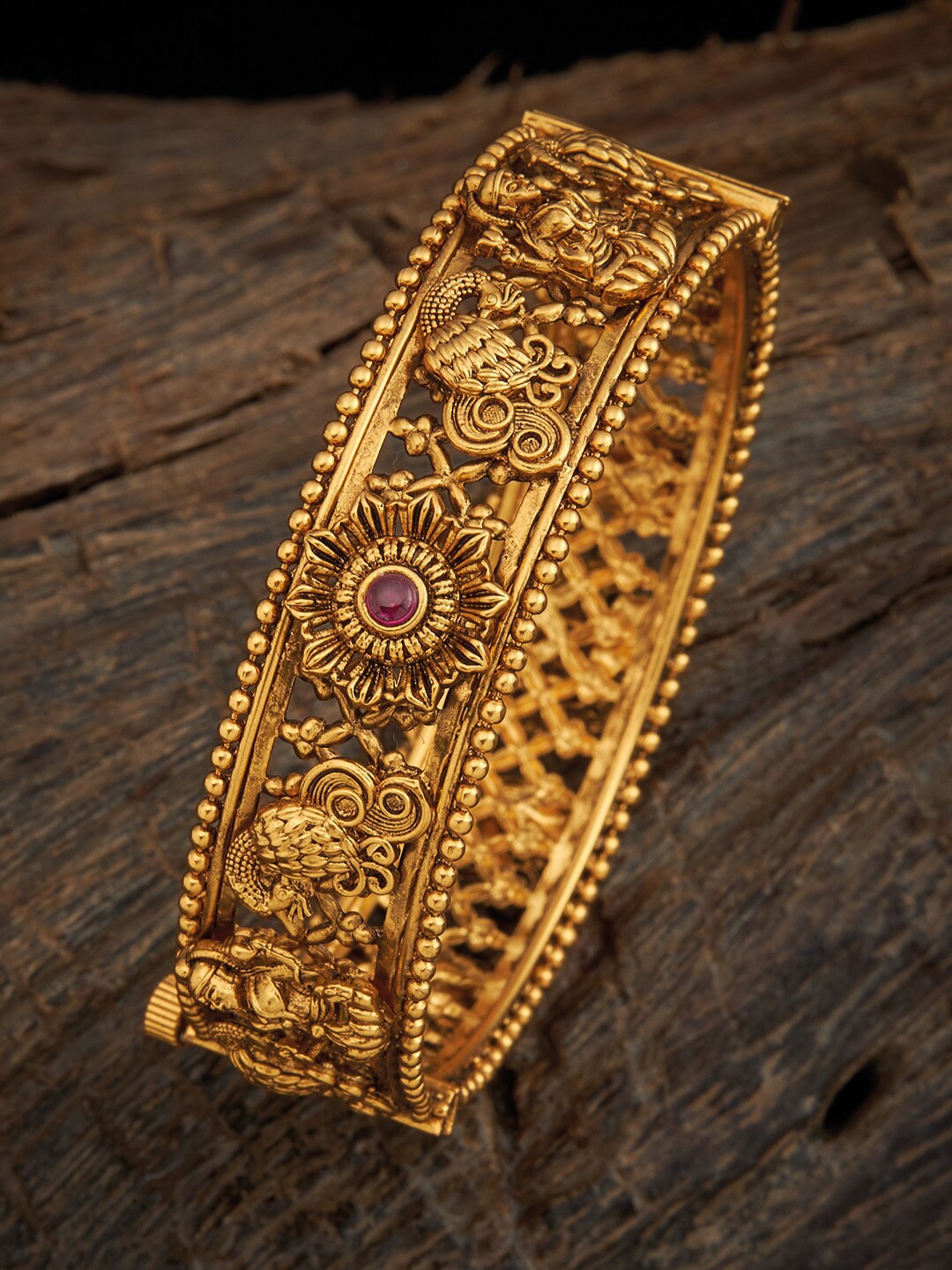 

Kushal's Fashion Jewellery Gold Plated Ruby Studded Antique Bangle