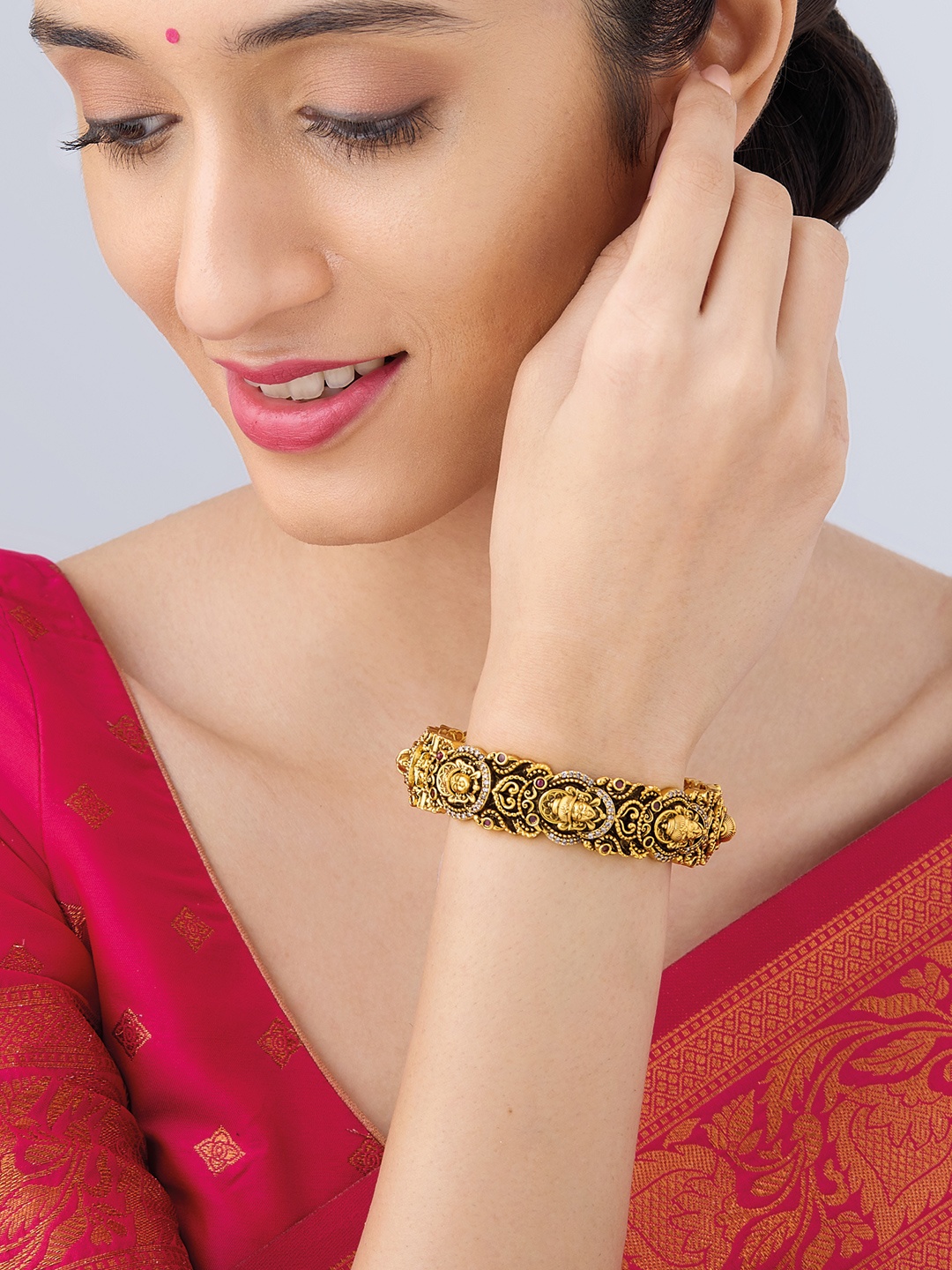 

Kushal's Fashion Jewellery Gold-Plated Stone-Studded Bangle