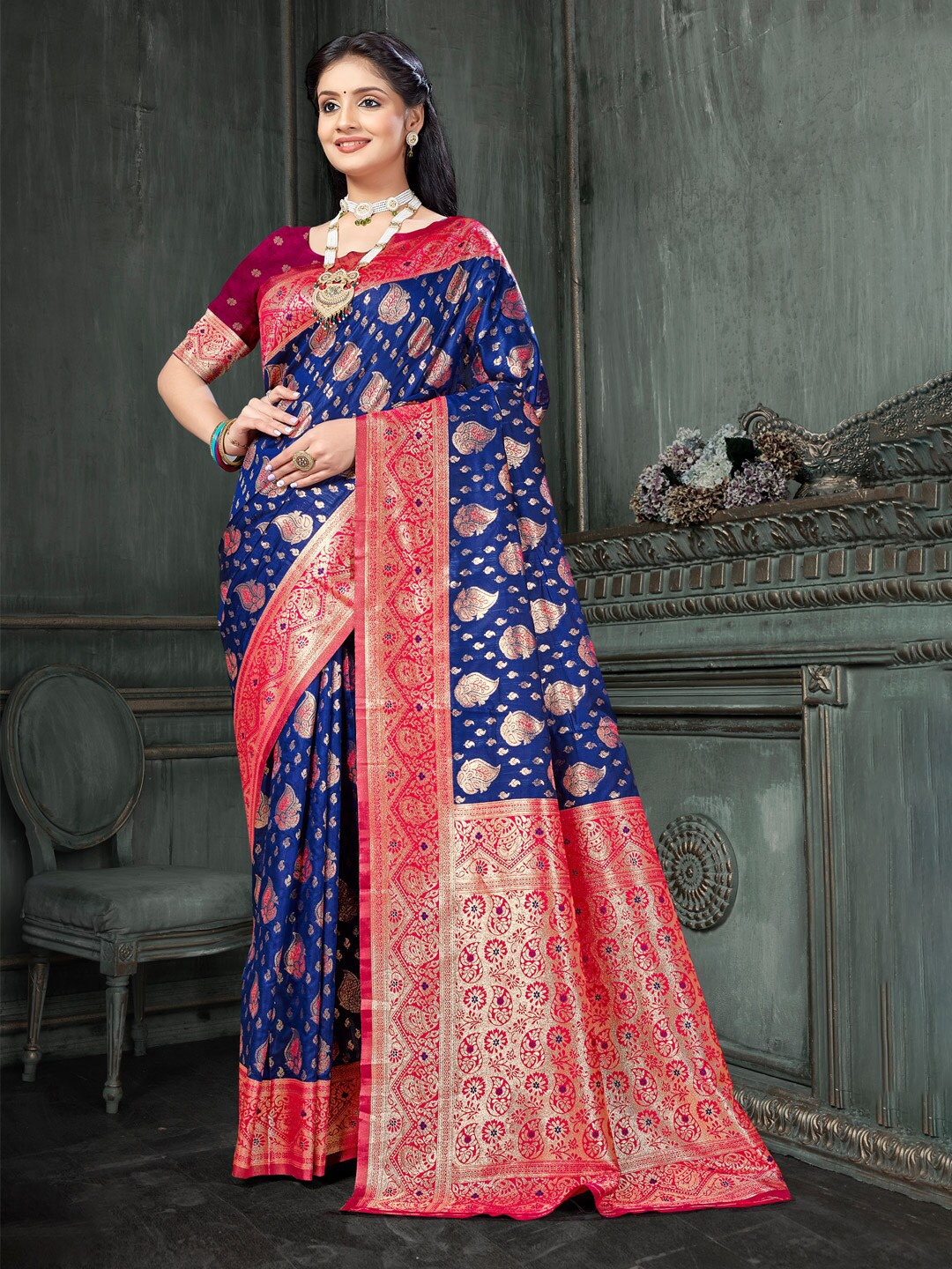 

Mitera Blue & Red Ethnic Motifs Woven Design Zari Saree