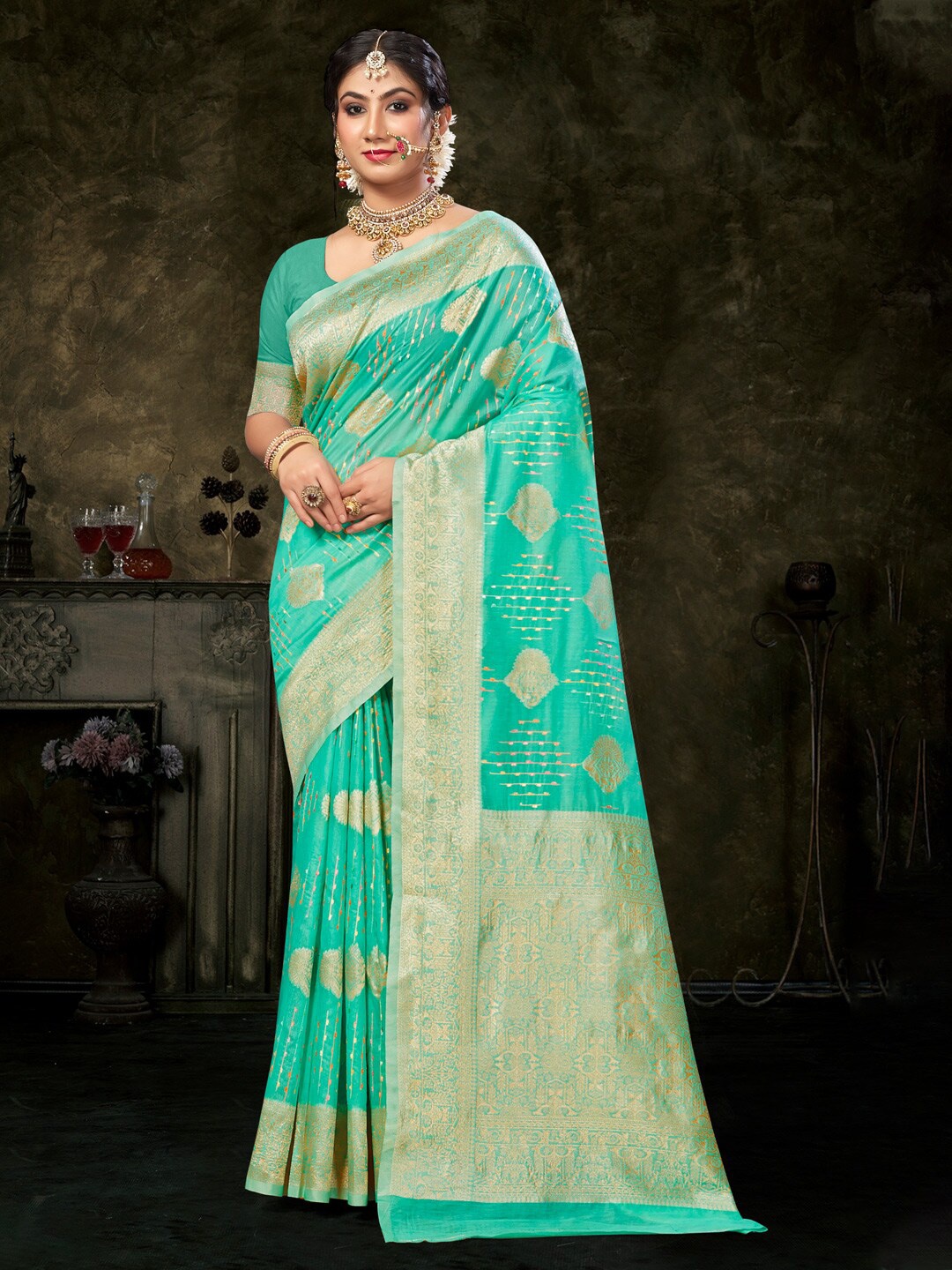 

Mitera Green Ethnic Motifs Woven Design Zari Detailed Saree