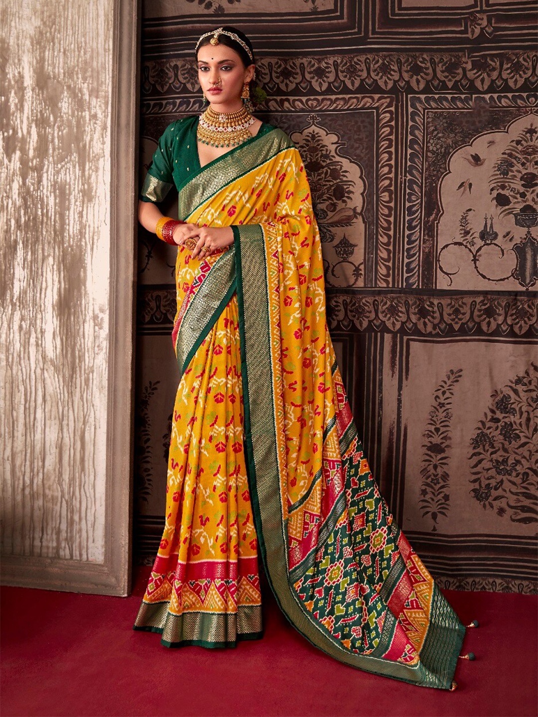 

Mitera Yellow & Red Floral Zari Silk Cotton Ikat Saree