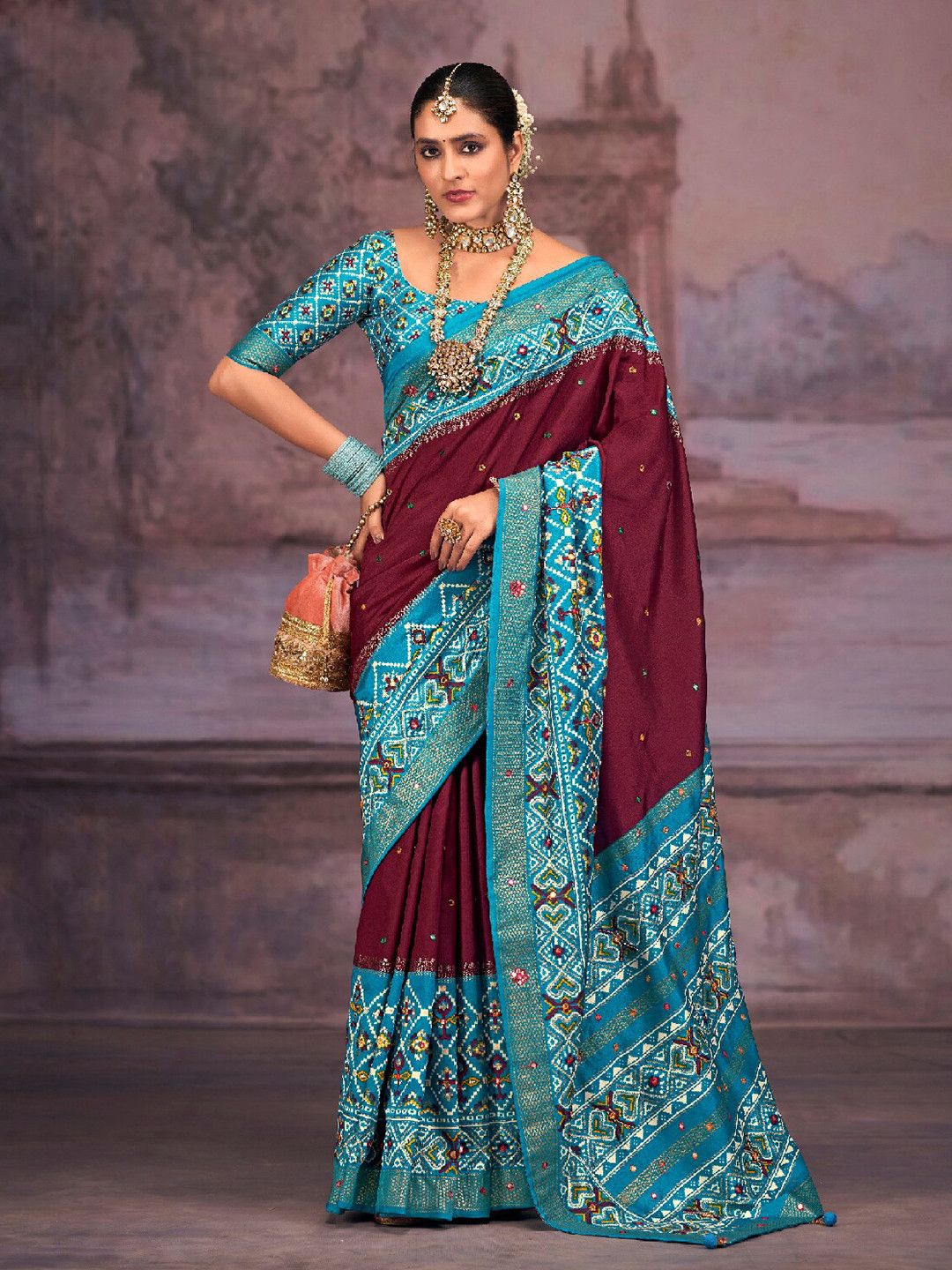 

Mitera Magenta & Blue Embellished Mirror Work Silk Cotton Patola Saree