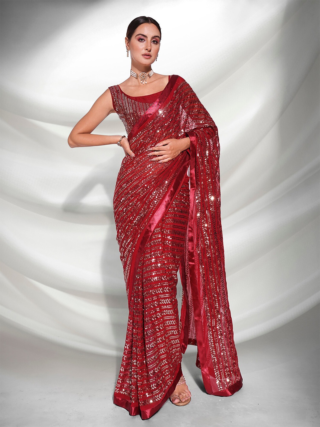 

Mitera Maroon & Gold Embellished Sequinned Pure Georgette Saree