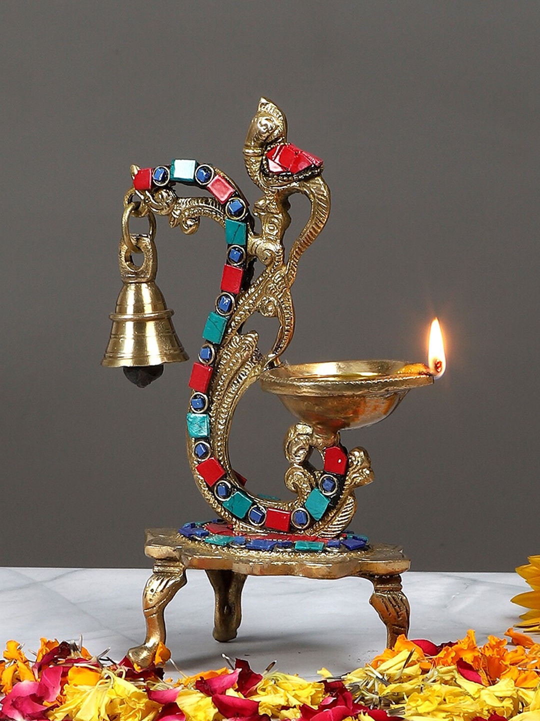 

Two Moustaches Gold-Toned Carved Peacock Design Brass Diya With Bell