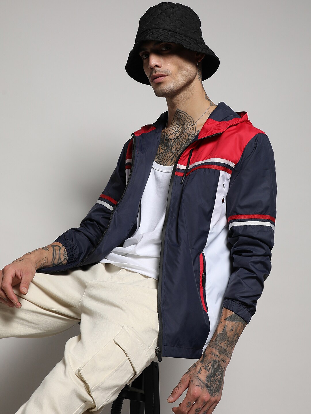 

Campus Sutra Navy Blue, White & Red Colourblocked Windcheater Outdoor Sporty Jacket