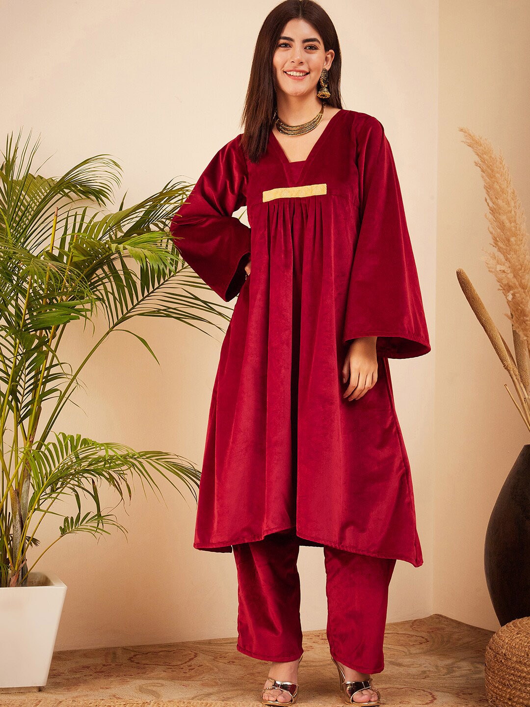 

InWeave Maroon V-Neck Flared Sleeves Empire A-Line Velvet Kurta with Trousers