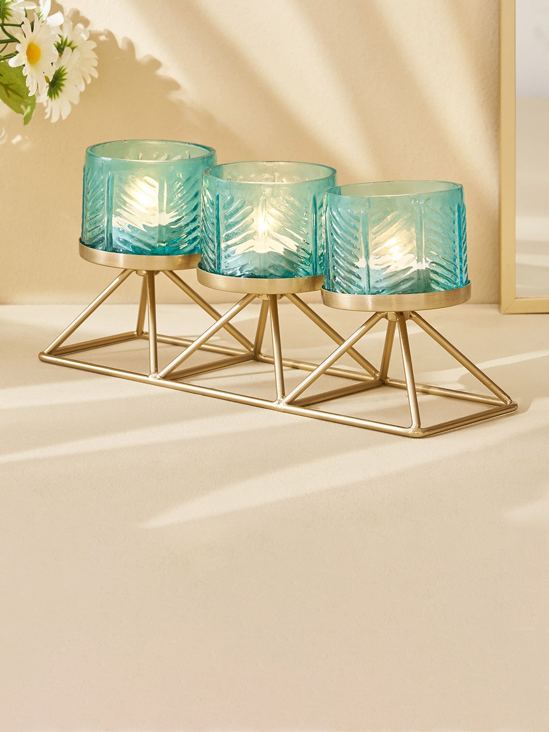 

Home Centre Blue 3 Pieces Glass Embossed T-Light Candle Holder