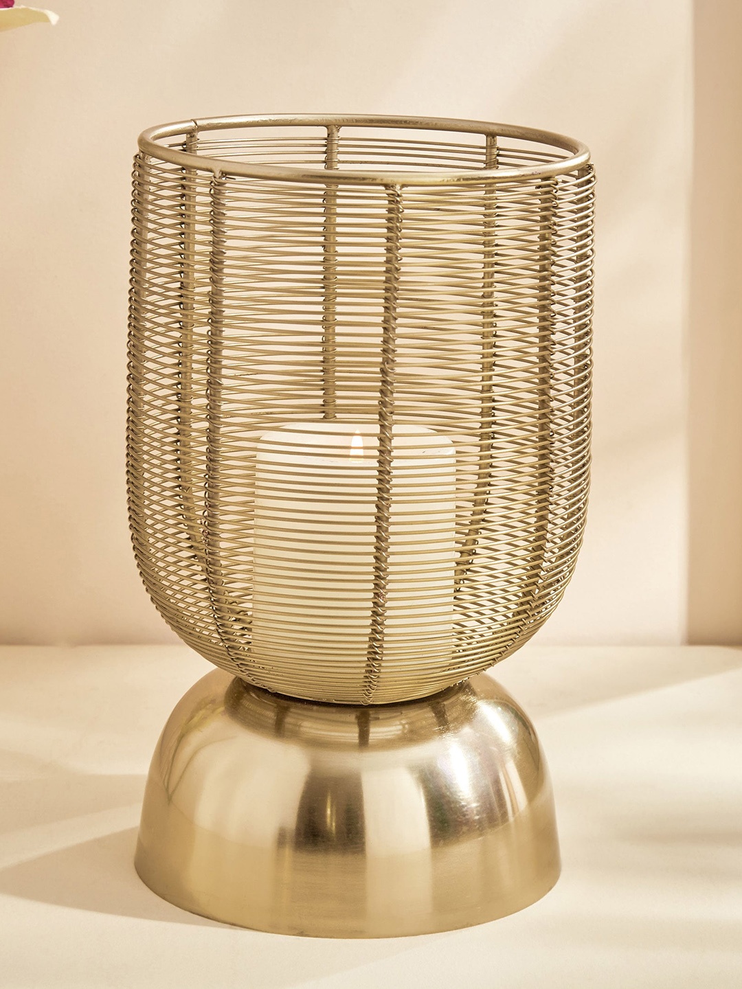 

Home Centre Splendid Megas Gold Toned Iron Wired Candle Holder