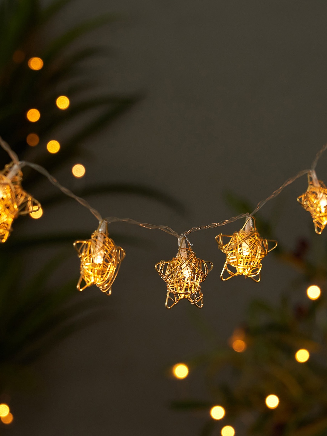 

Home Centre Serena Slice Gold Toned 10 Bulbs Metallic Star String Lights