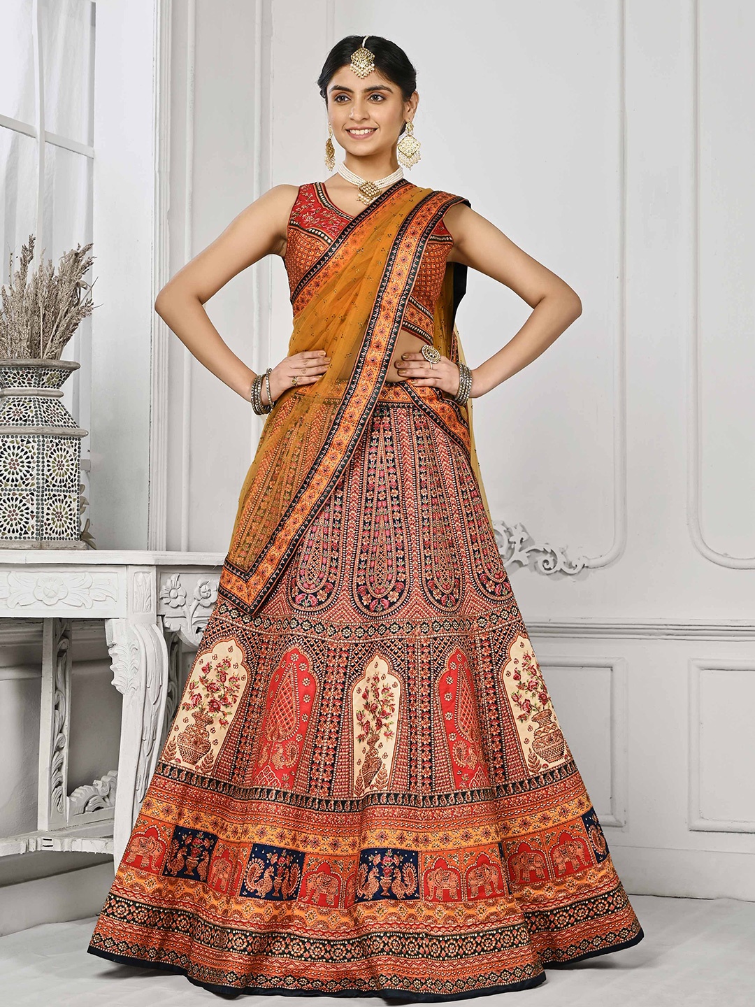 

SAPTRANGI Ethnic Motifs Printed Beads And Stones Semi-Stitched Lehenga Choli, Orange
