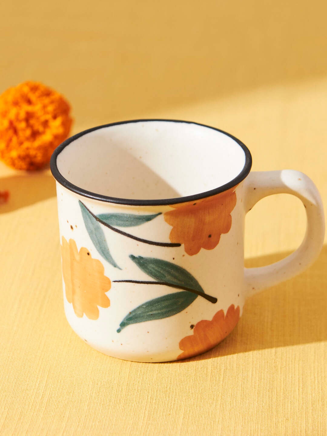 

Chumbak Marigold White & Green Hand Painted Printed Ceramic Matte Mug 150 ml