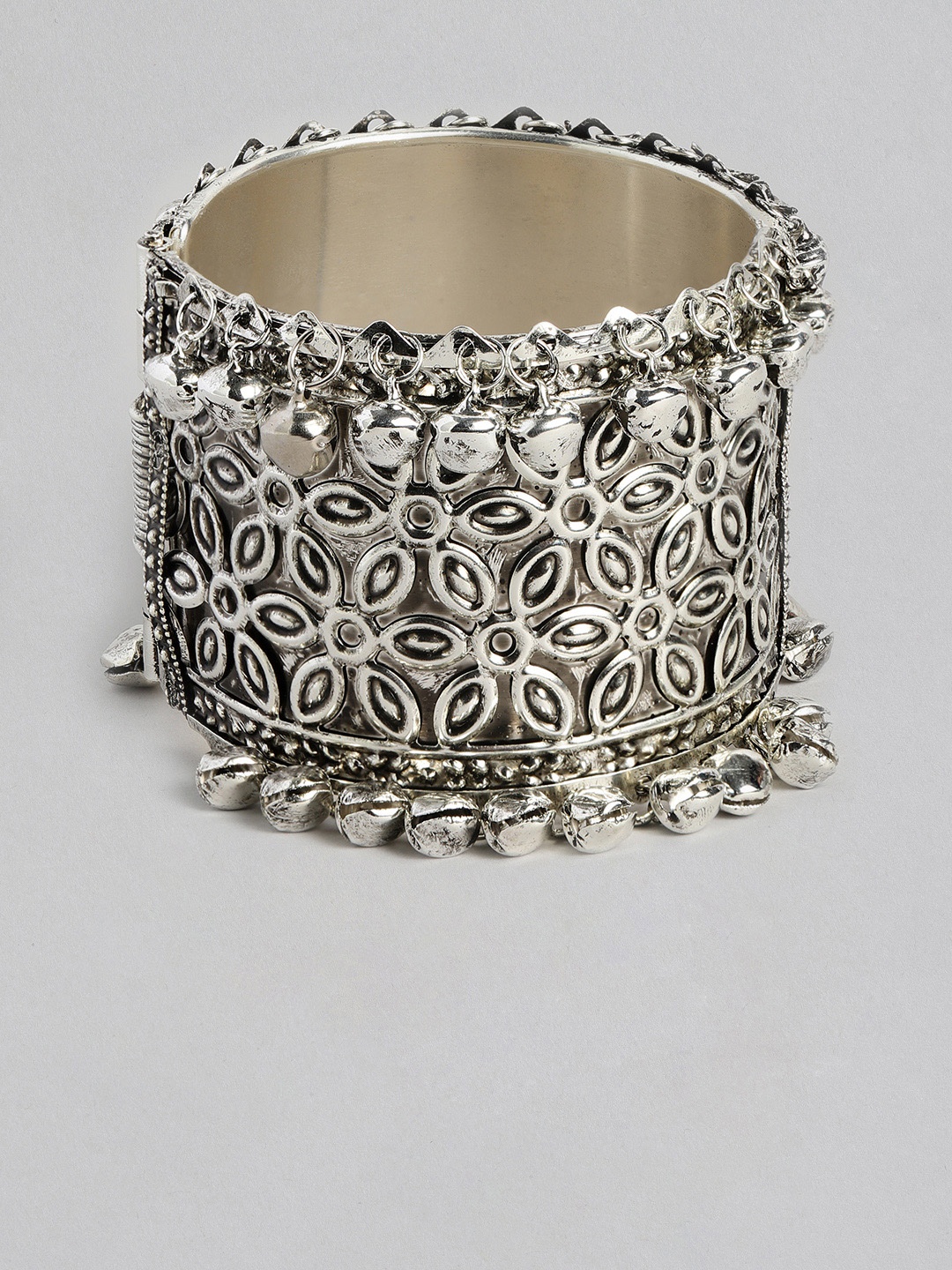 

Sangria Women Silver-Plated Floral Textured Oxidised Cuff Bracelet with Attached Bells