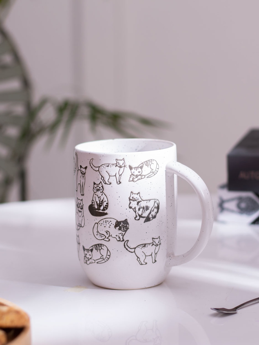 

THEDECORKART White & Black Printed Ceramic Glossy Mugs 300 ml