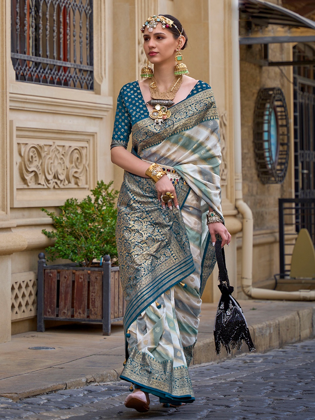 

Mitera Blue & White Ethnic Motifs Woven Design Zari Silk Blend Saree