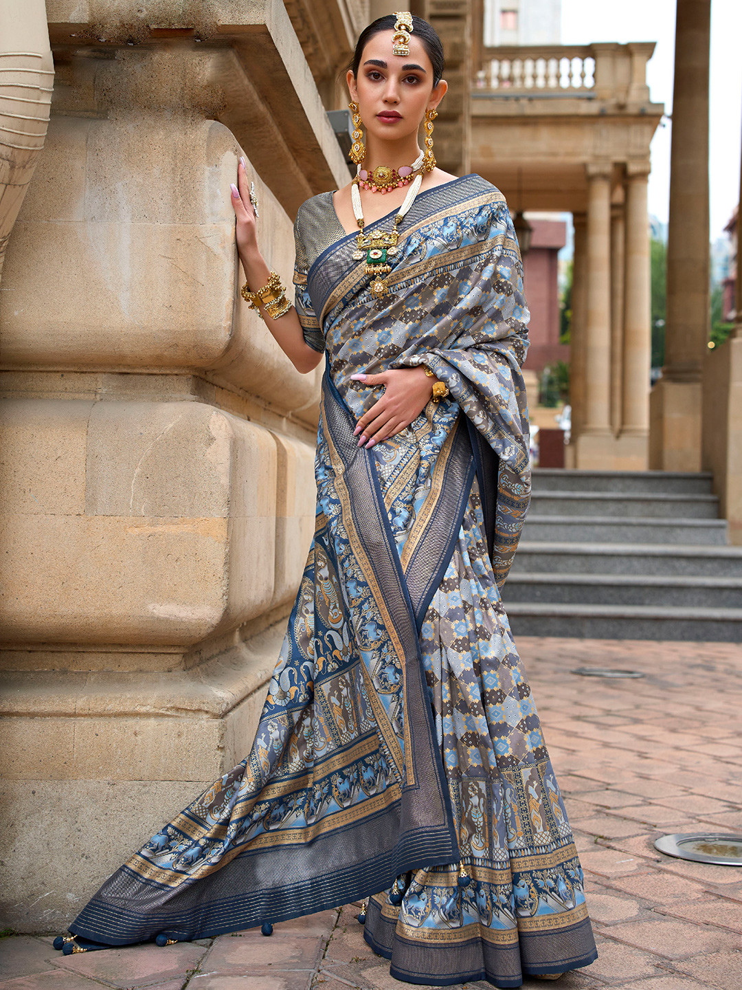 

Mitera Teal & Gold-Toned Ethnic Motifs Woven Design Zari Silk Blend Saree
