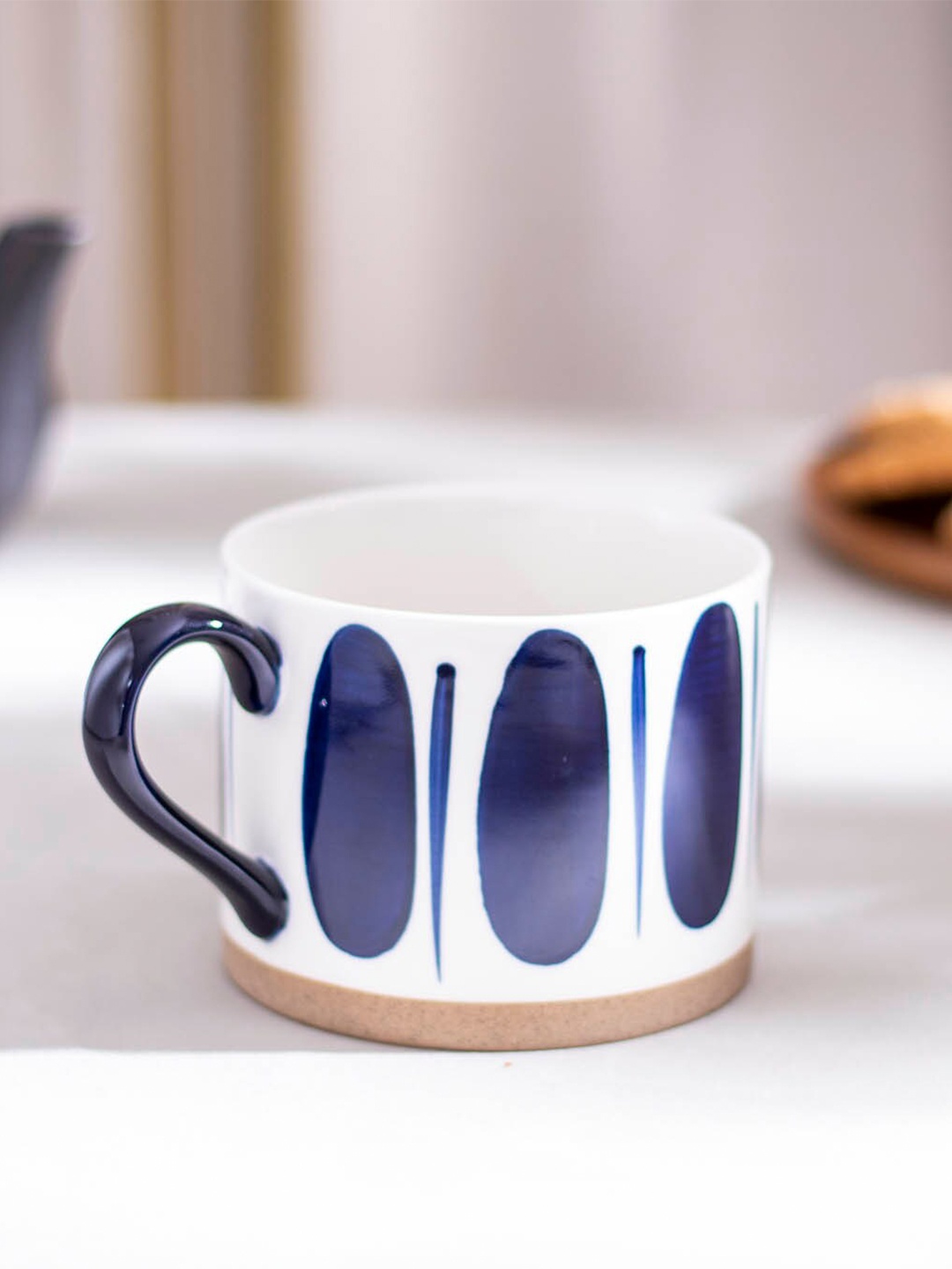 

THEDECORKART White & Blue Printed Ceramic Glossy Cup 200ml