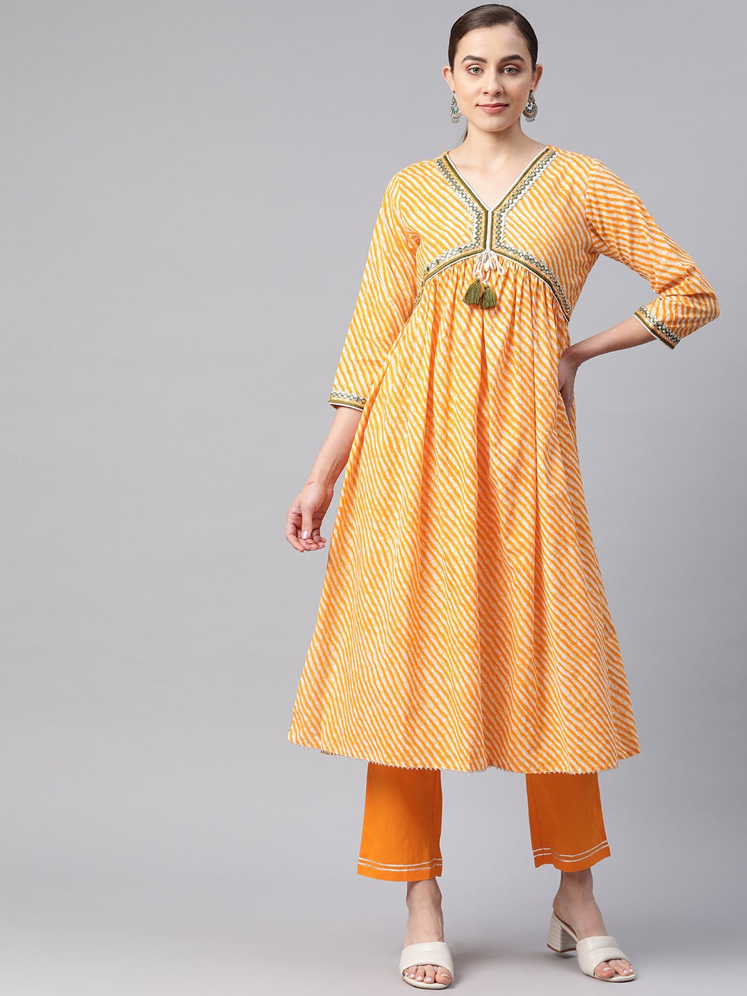 

Readiprint Women Leheriya Printed Pleated Mirror Work Kurta with Palazzos, Yellow