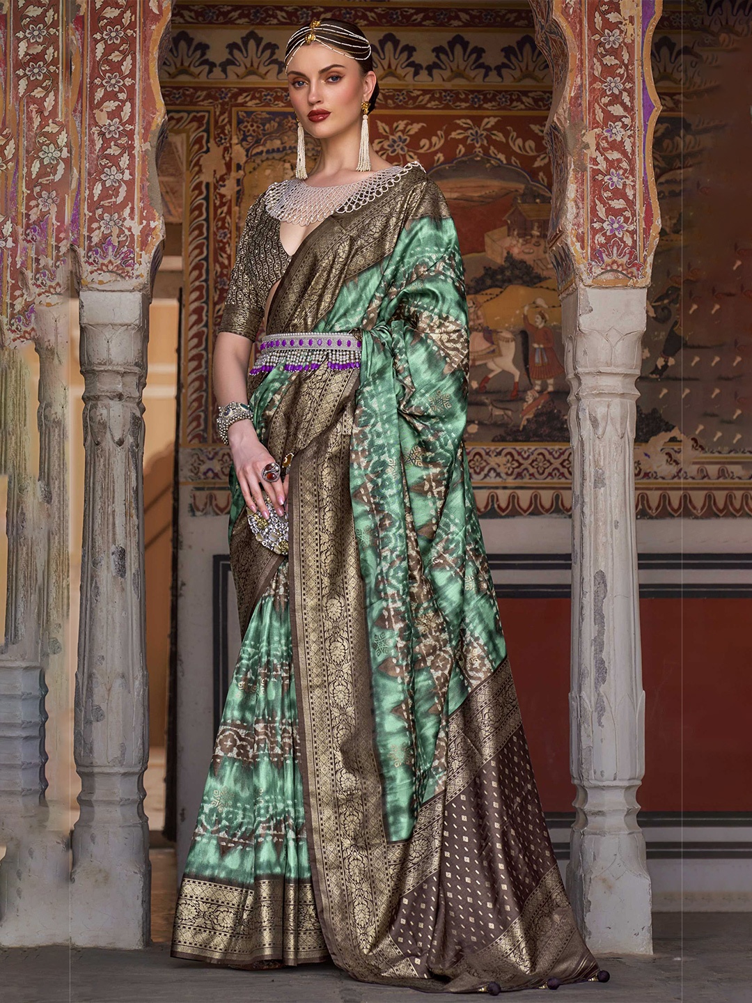 

Mitera Teal & Black Ethnic Motifs Printed Zari Patola Saree