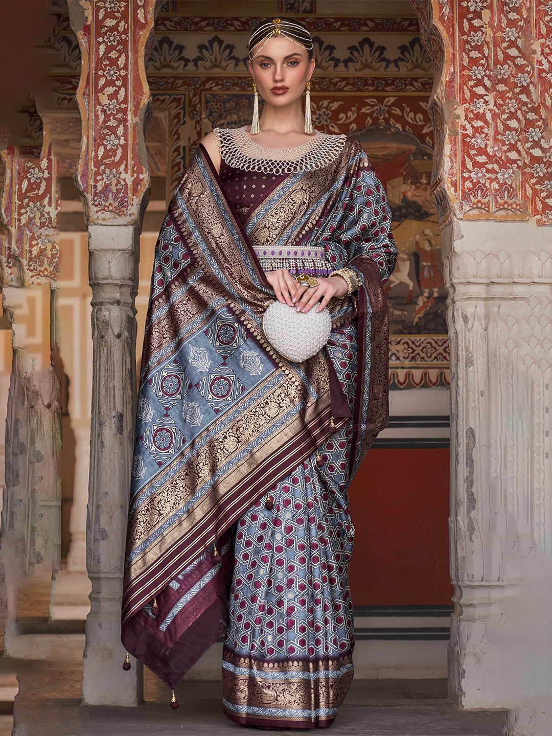 

Mitera Grey & Purple Ethnic Motifs Printed Zari Patola Saree