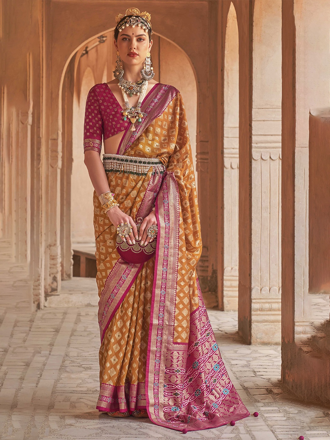 

Mitera Orange & Red Ethnic Motif Woven Design Zari Patola Saree