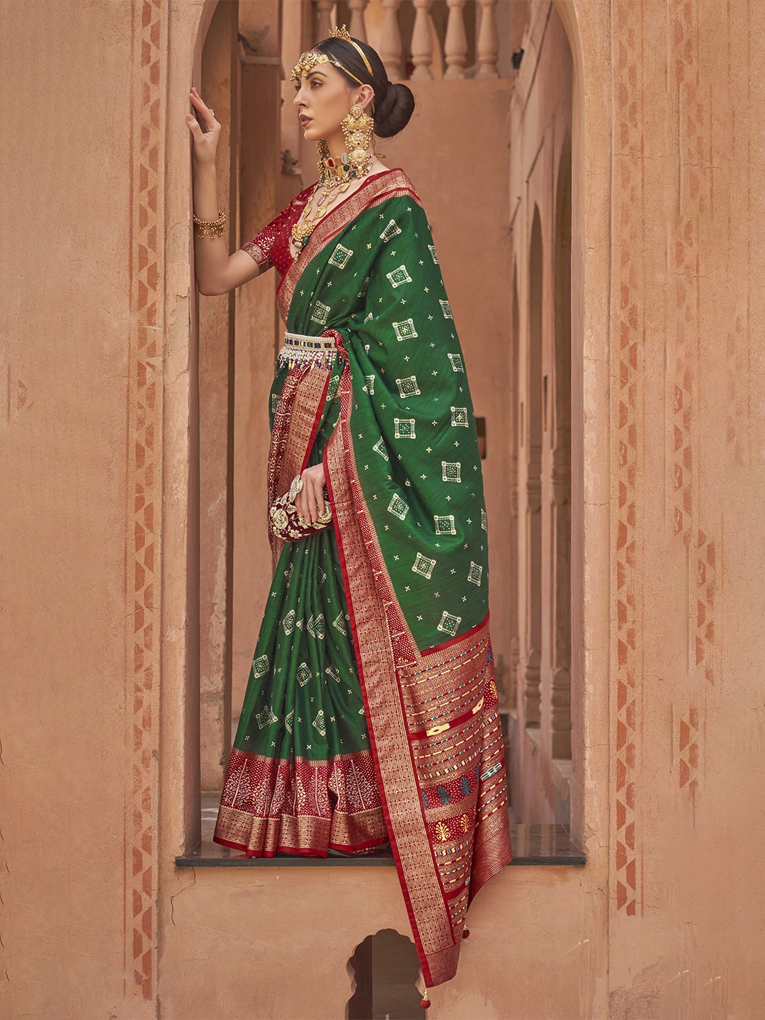 

Mitera Green & Red Ethnic Motifs Woven Design Zari Silk Blend Patola Saree